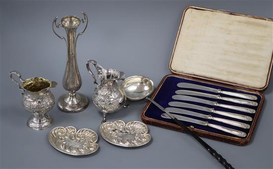 Two 18th century late embossed silver cream jugs, a silver toddy ladle, Art Nouveau vase, pair of pin trays and cased set of knives.